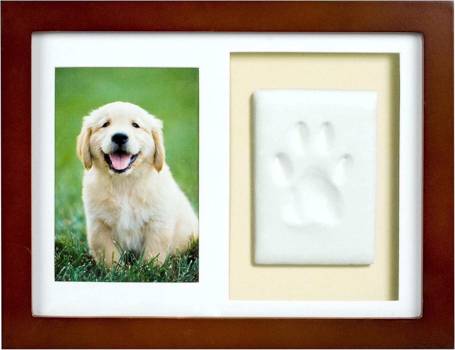 Wooden picture frame with a photo and clay paw print