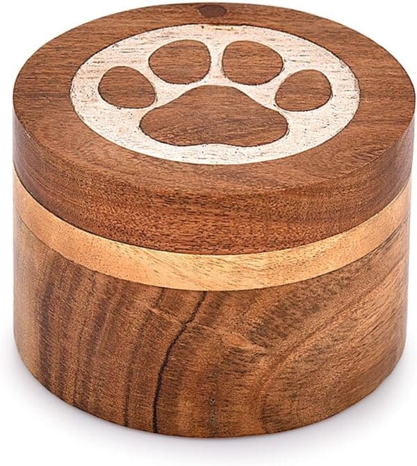 A wooden box with a paw print on it.